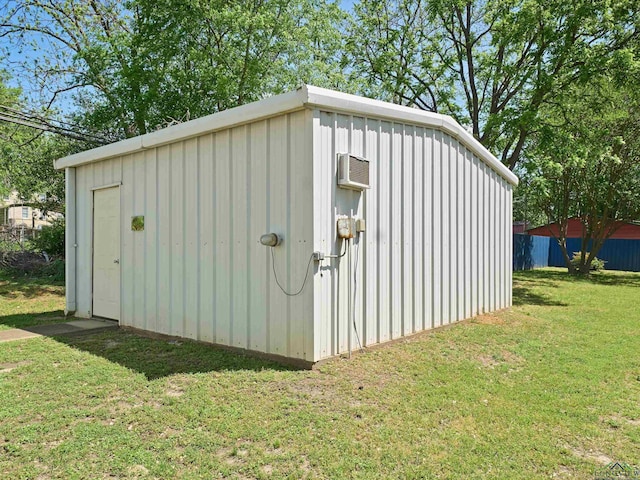 view of outdoor structure featuring an outdoor structure and an AC wall unit
