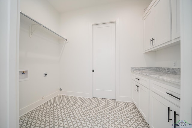 laundry area with cabinets, washer hookup, gas dryer hookup, and electric dryer hookup