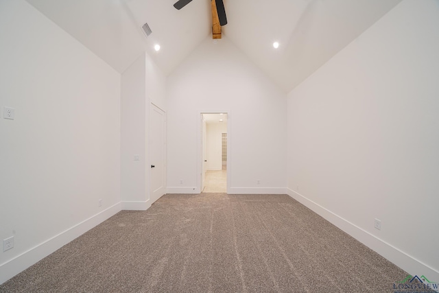 carpeted spare room with ceiling fan, high vaulted ceiling, and beamed ceiling