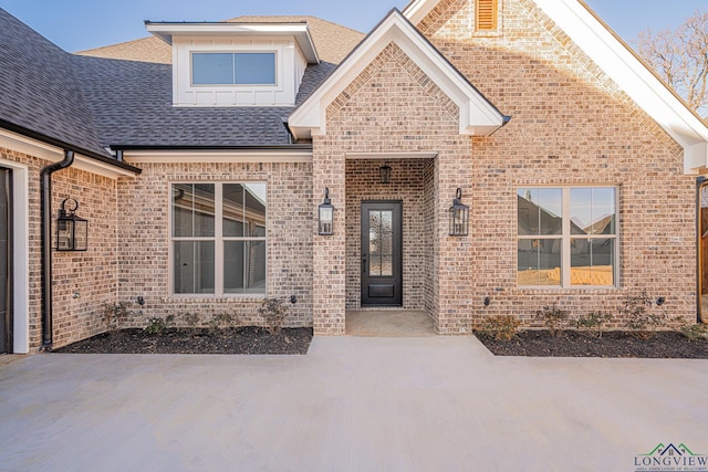 property entrance featuring a patio