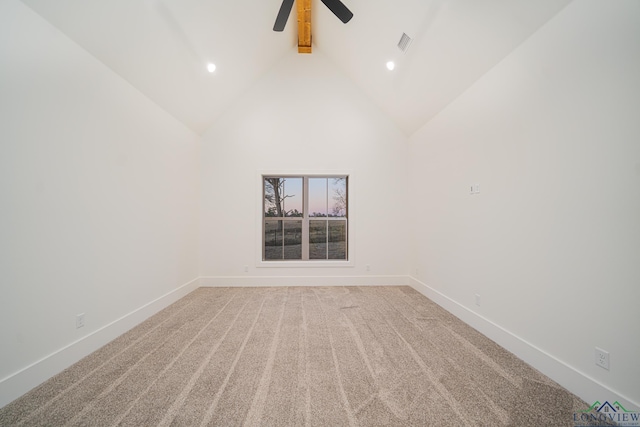 carpeted empty room with high vaulted ceiling, ceiling fan, and beamed ceiling