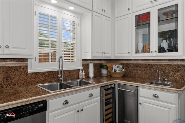 kitchen with dishwasher, white cabinets, beverage cooler, and sink