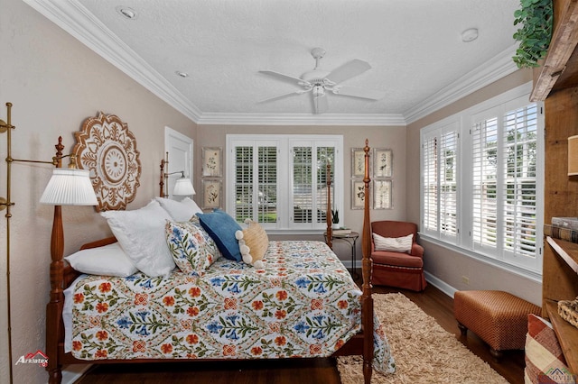 bedroom with a textured ceiling, dark hardwood / wood-style flooring, ceiling fan, and ornamental molding