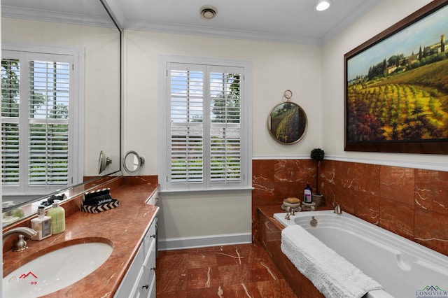 bathroom with vanity, ornamental molding, and a bath