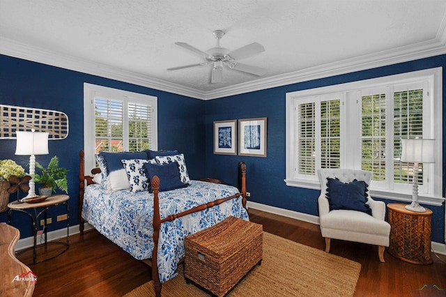 bedroom with ceiling fan, dark hardwood / wood-style flooring, a textured ceiling, and ornamental molding