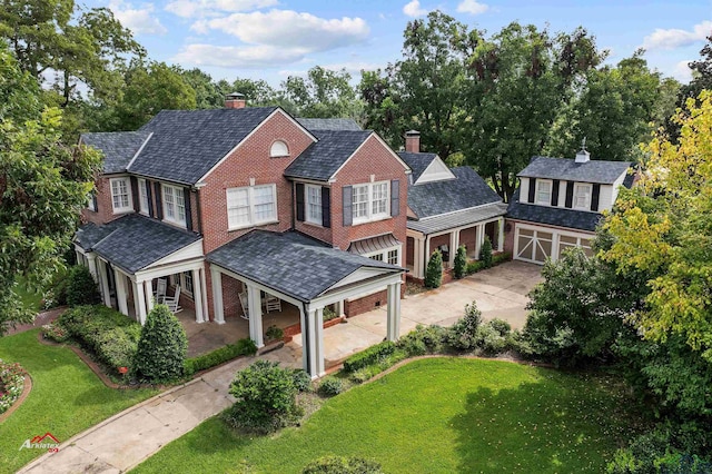 view of front of property with covered porch and a front yard