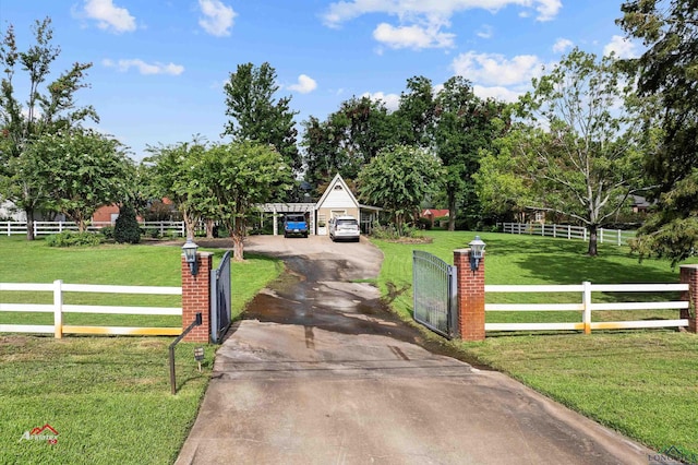 exterior space with a rural view and a front yard