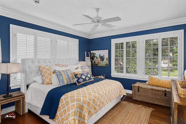 bedroom featuring ceiling fan, dark wood-type flooring, and ornamental molding