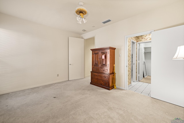 unfurnished room with light carpet