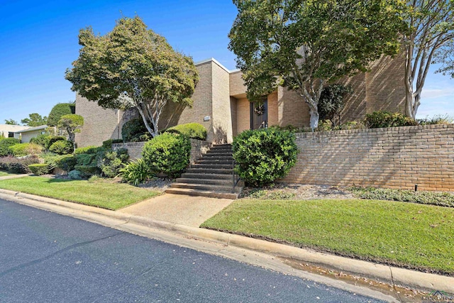 view of front of property with a front lawn