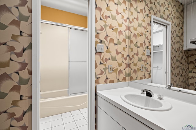 bathroom featuring vanity and enclosed tub / shower combo