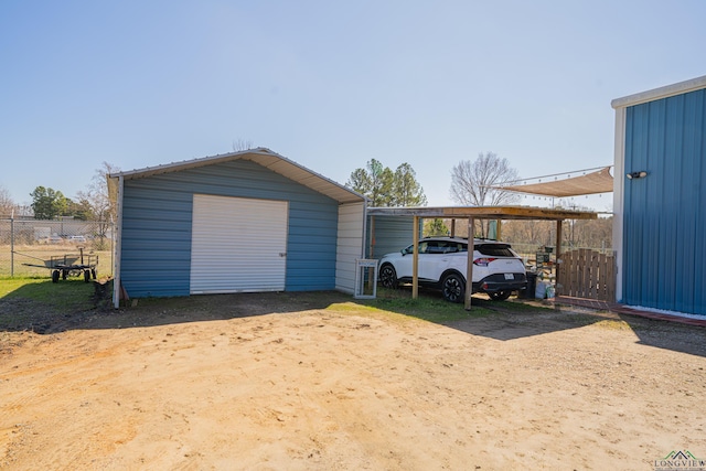 garage with a garage and fence