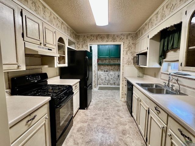 kitchen with black appliances, crown molding, sink, and a textured ceiling