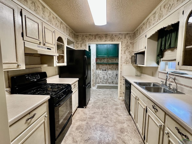 1400 Shreveport St, Elysian Fields, TX 75642 - kitchen with black appliances, under cabinet range hood, wallpapered walls, a textured ceiling, and light countertops
