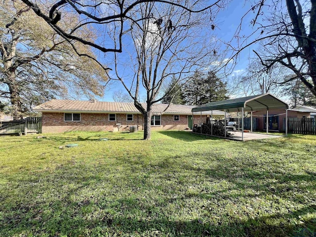 view of yard with a carport