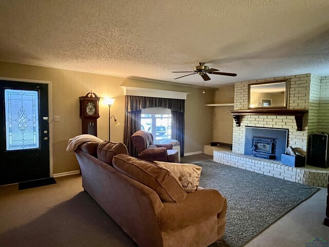 1400 Shreveport St, Elysian Fields, TX 75642 - living area featuring a textured ceiling, a ceiling fan, carpet flooring, and a brick fireplace