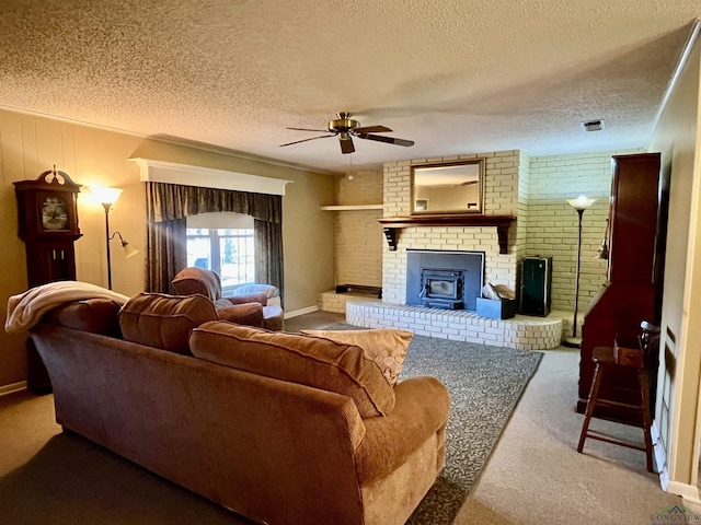 1400 Shreveport St, Elysian Fields, TX 75642 - living area with ceiling fan, a textured ceiling, carpet floors, and a brick fireplace