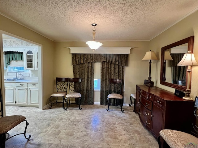 sitting room with a textured ceiling and sink