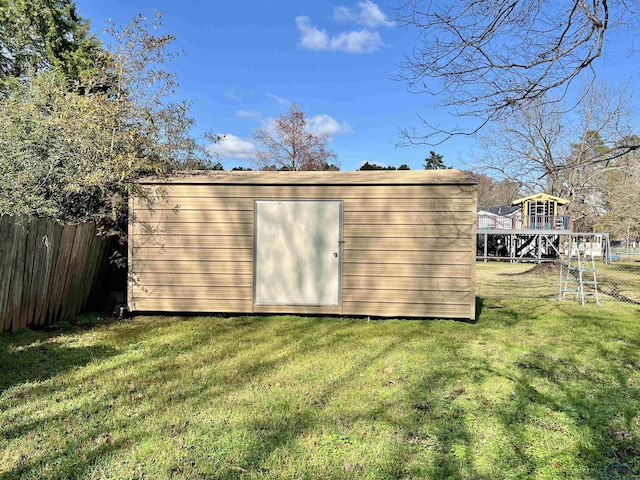 view of outbuilding with a lawn