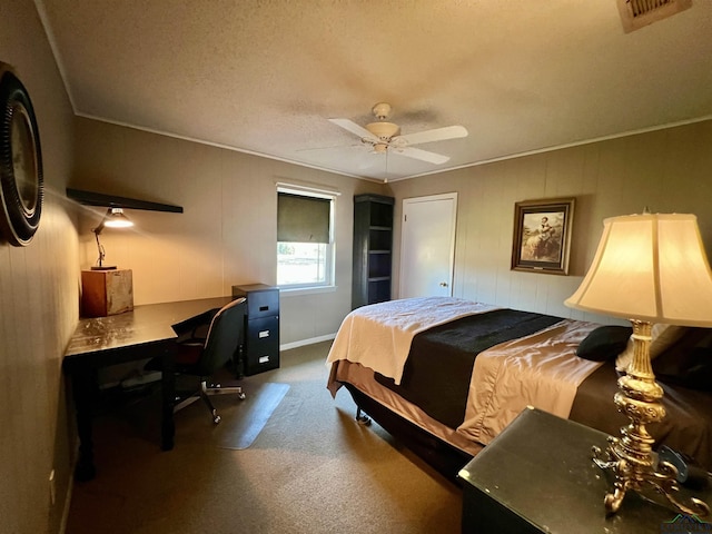 bedroom with a textured ceiling, ceiling fan, and crown molding