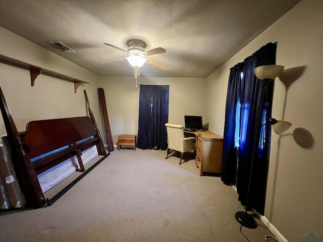 office featuring ceiling fan and light colored carpet