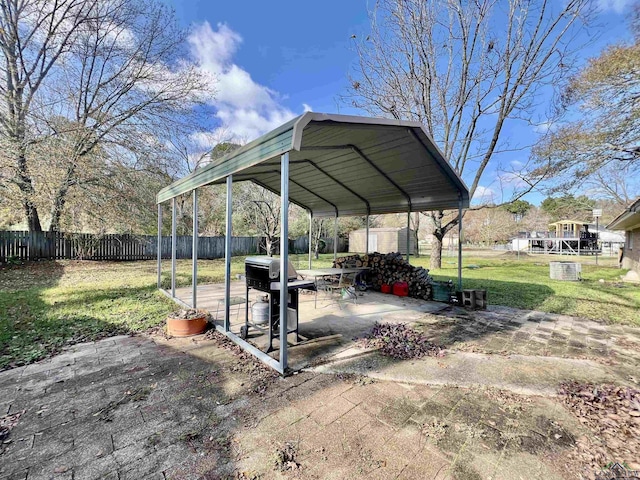 1400 Shreveport St, Elysian Fields, TX 75642 - view of car parking with a carport and asphalt driveway