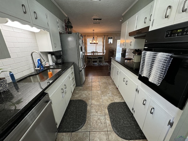 kitchen with sink, white cabinets, a textured ceiling, and appliances with stainless steel finishes