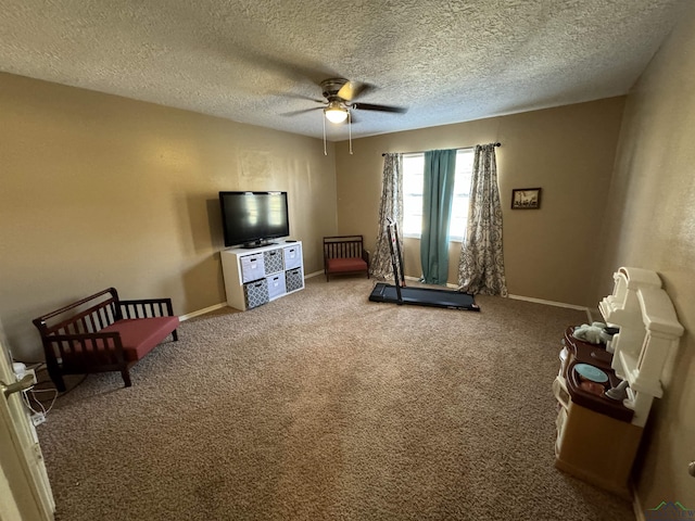 interior space with ceiling fan and a textured ceiling