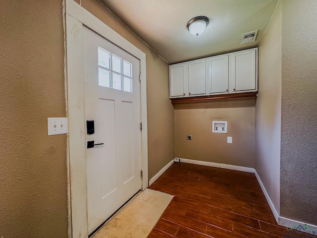 laundry area featuring hookup for an electric dryer, dark wood-type flooring, baseboards, cabinet space, and washer hookup