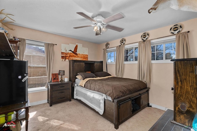 carpeted bedroom with ceiling fan