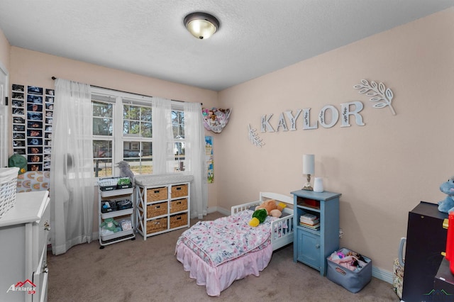 carpeted bedroom with a textured ceiling