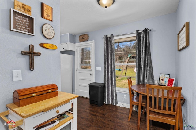 dining room with dark wood-type flooring