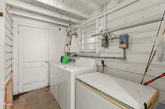 clothes washing area with separate washer and dryer