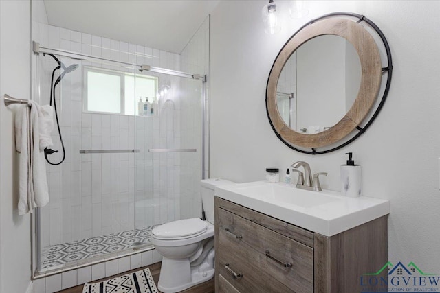 299 Southshore Dr, Lone Star, TX 75668 - full bathroom with vanity, a stall shower, and toilet