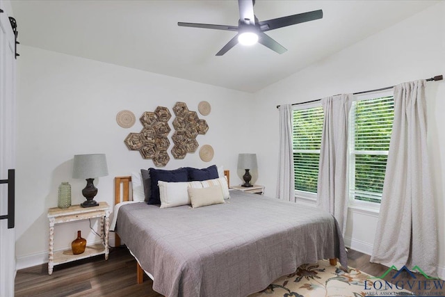 299 Southshore Dr, Lone Star, TX 75668 - bedroom featuring baseboards, wood finished floors, vaulted ceiling, and a ceiling fan