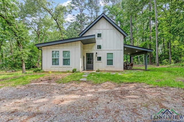 299 Southshore Dr, Lone Star, TX 75668 - view of front facade with board and batten siding
