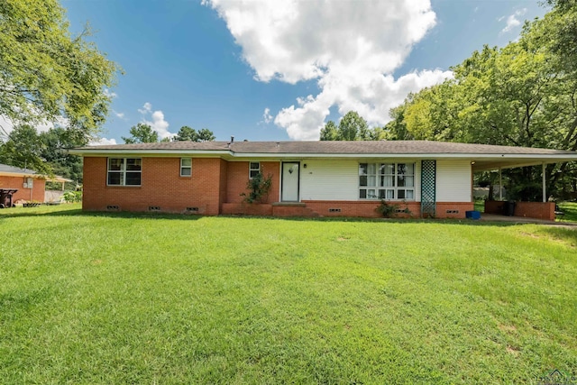 ranch-style house with a front yard and a carport