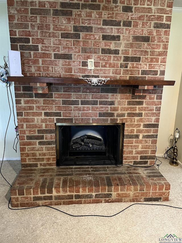 room details featuring carpet flooring and a fireplace