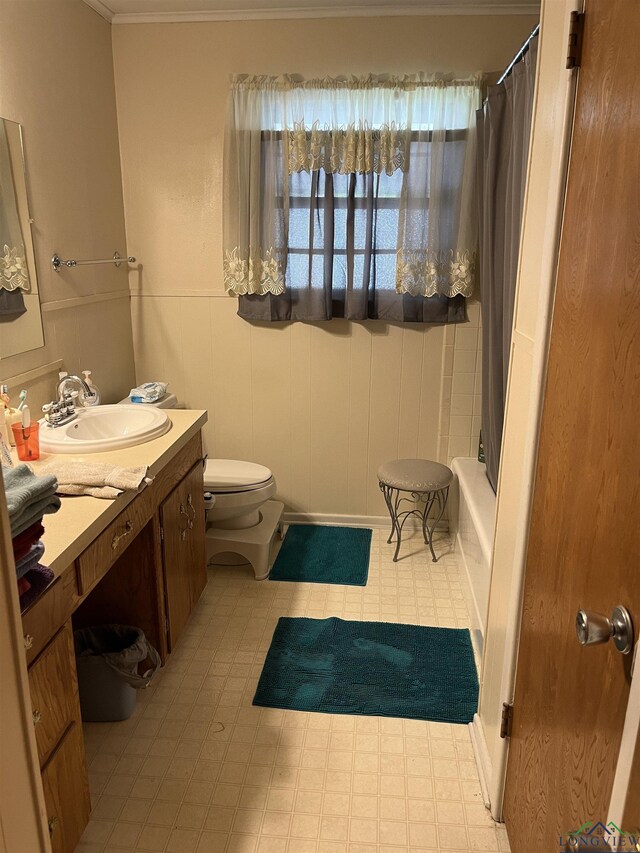 full bathroom with vanity, shower / bath combo, and toilet