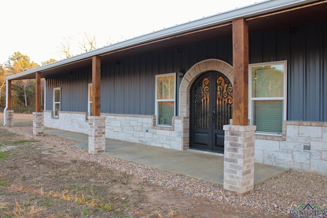 doorway to property with a porch