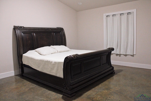 bedroom with lofted ceiling