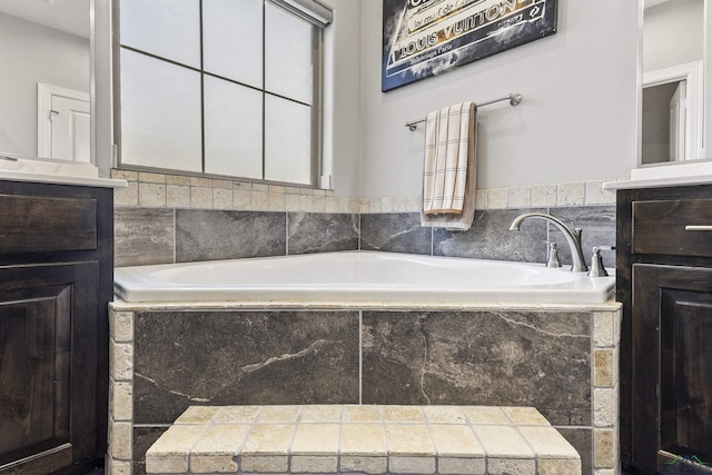 bathroom featuring vanity and a garden tub