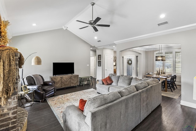 living room featuring arched walkways, visible vents, vaulted ceiling with beams, and dark wood-style flooring