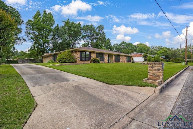 1611 Springdale St, Longview, TX 75604 - ranch-style home featuring driveway, a front lawn, and brick siding