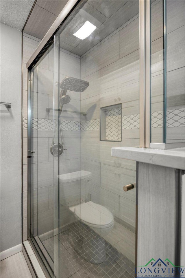 1611 Springdale St, Longview, TX 75604 - full bathroom featuring a shower stall and toilet