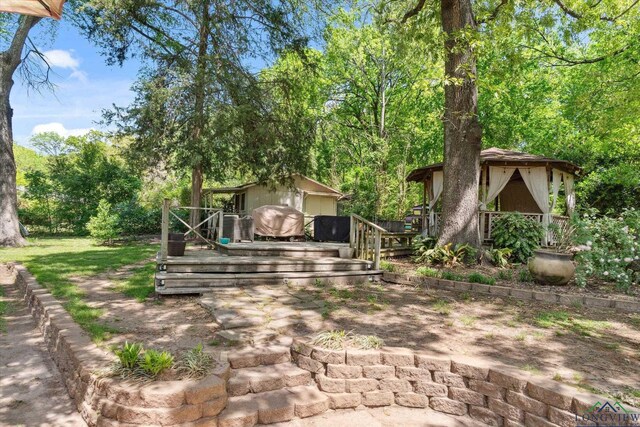 1492 Sleepy Hollow Ln, Canton, TX 75103 - view of yard featuring a wooden deck and an outbuilding