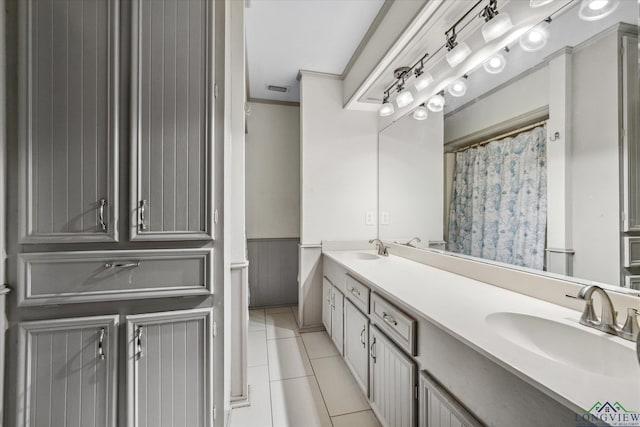 1492 Sleepy Hollow Ln, Canton, TX 75103 - bathroom featuring crown molding, tile patterned flooring, a sink, and double vanity