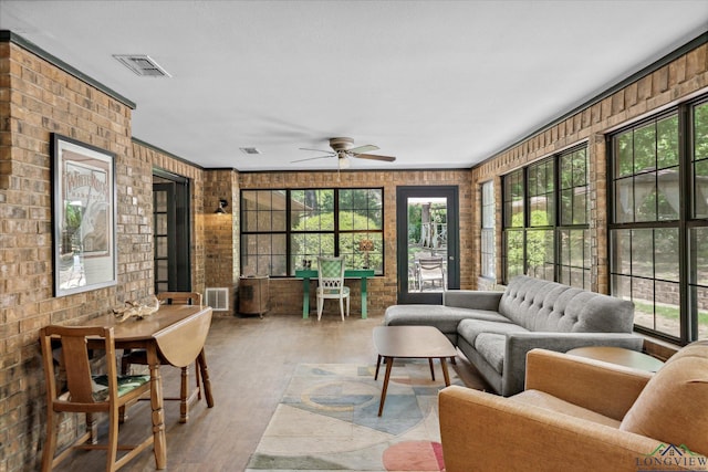 1492 Sleepy Hollow Ln, Canton, TX 75103 - sunroom / solarium with brick wall, wood finished floors, visible vents, and a wealth of natural light