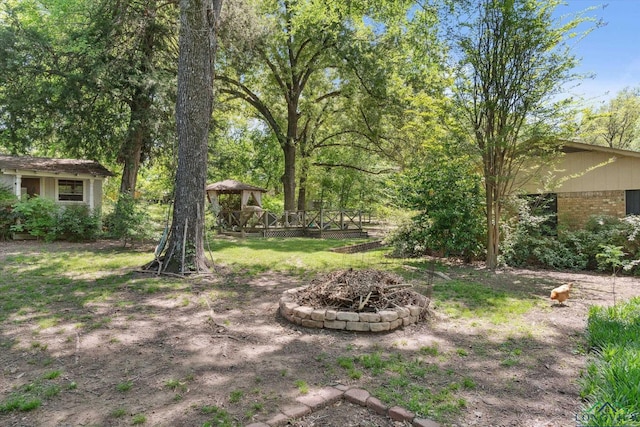 1492 Sleepy Hollow Ln, Canton, TX 75103 - view of yard featuring a gazebo, an outdoor fire pit, and a deck