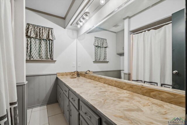 1492 Sleepy Hollow Ln, Canton, TX 75103 - bathroom featuring tile patterned floors, a wainscoted wall, visible vents, and vanity
